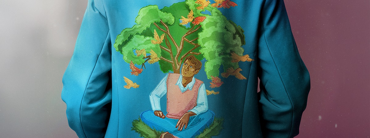 An illustration on the back of a light blue jacket shows a man sitting underneath a tree in a promotional image for English Touring Opera's What Dreams May Come.