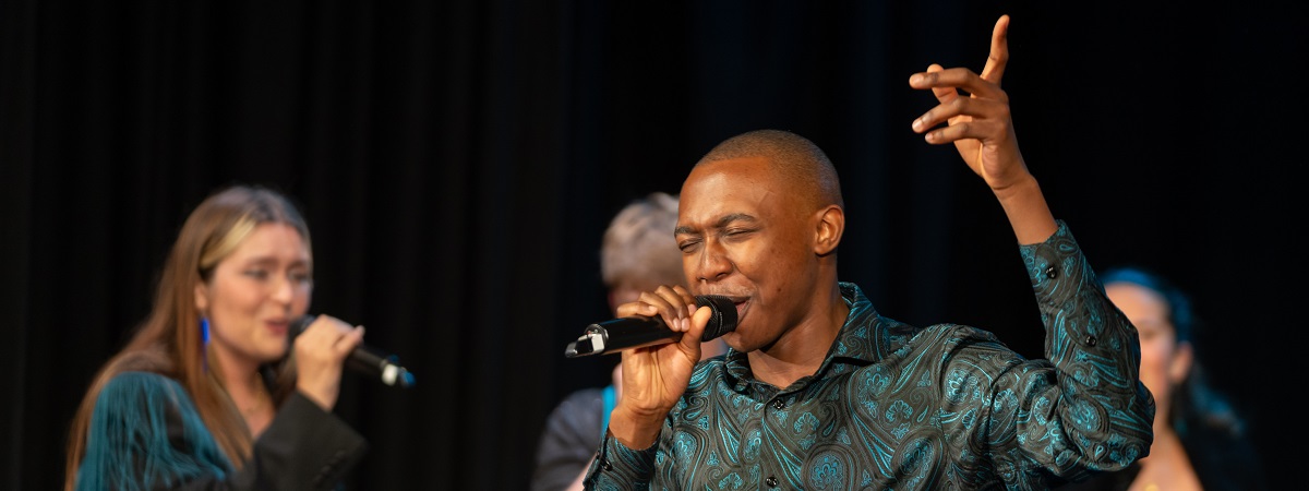 A Capella singers perform in a promotional image for Northern Lights.