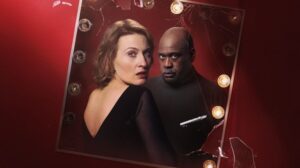 Two performers - one looking over their shoulder and the other looking forward - face a dressing room mirror in campaign artwork for English Touring Opera's Pagliacci.