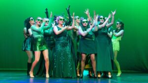 Performers dancing and singing from New College Durham.