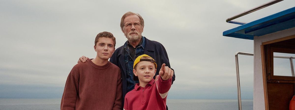 Roman Griffin Davis, Dexter Sol Ansell and Bill Nighy in a still from 500 Miles.