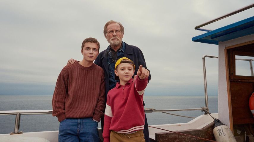 Roman Griffin Davis, Dexter Sol Ansell and Bill Nighy in a still from 500 Miles.