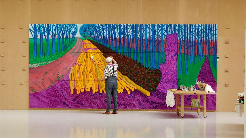 David Hockney painting Winter Timber in Bridlington, July 2009 in an image from Exhibiton On Screen: David Hockney at The Royal Academy of Arts © David Hockney photo credit Jean-Pierre Gonçalves de Lima