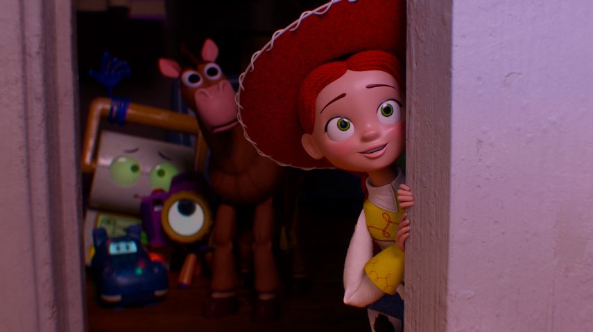 Jessie, Bullseye and other toys watch on in a still from Toy Story 5.